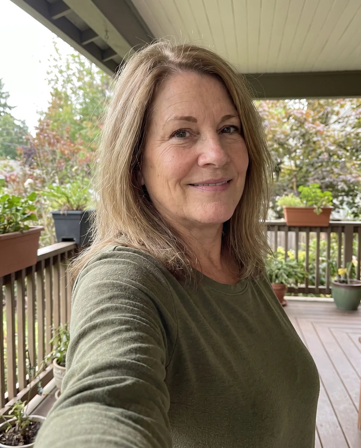 Illustrative candid phone portrait of Laura, 52