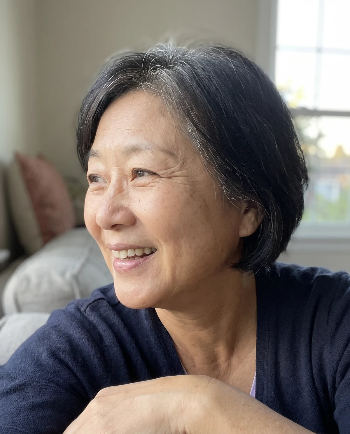 Illustrative candid phone portrait of Hana, 57