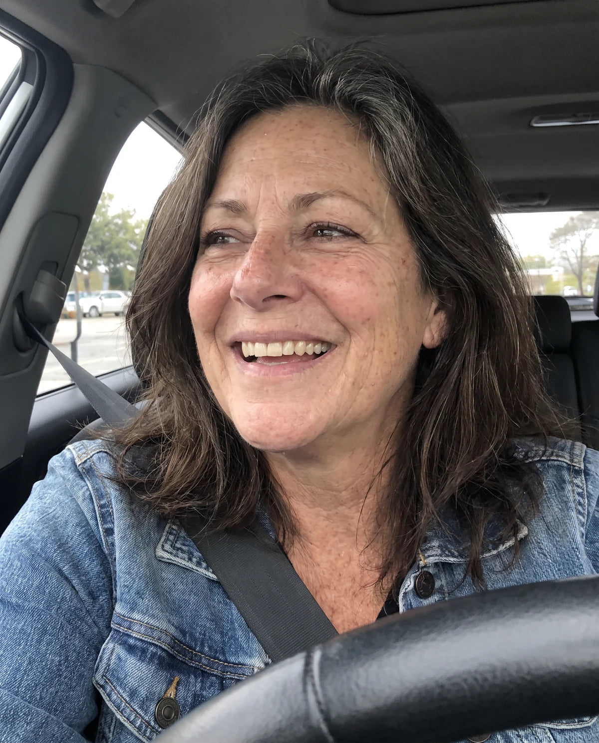 Illustrative candid phone portrait of Rachel, 59